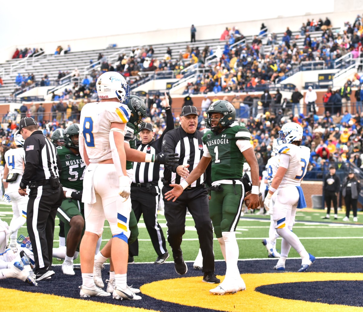 Muskogee quarterback Jamarian Ficklin (1) celebrates after scoring a touchdown during the Roughers' 28-26 win against Stillwater in the Class 6AII championship game Dec. 1, 2023. (Photo by Michael Kinney) 